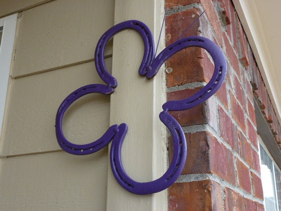 Purple butterfly art made out of horseshoes; decoration is great for a barn, porch, yard, or little girl's bedroom or bathroom