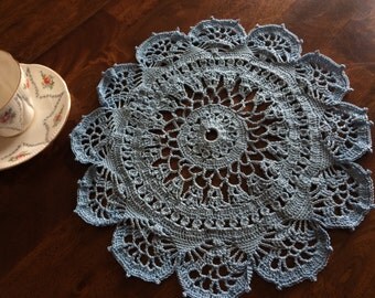 Set of three powder blue crocheted doilies. Handmade with love.