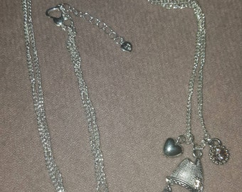 Silver chain necklace with either pink or blue fish pendant