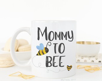 Mommy to bee.Pregnancy announcement.We're pregnant!.New mom.Mom coffee mug.Coffee mug.Coffee cup.Dishwasher + microwave safe.