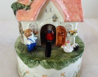 1983 Schmid Cottage Music Box Moving Girl Plays Tomorrow. Signed on Side. pLays Beautiful.