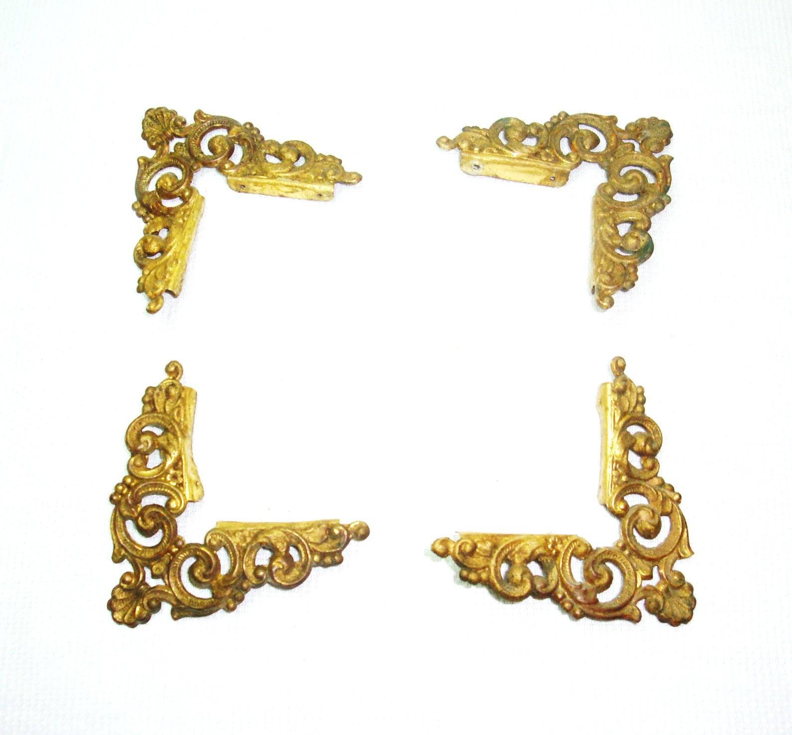 Tin picture frame corners. Metal ornamental picture frame corners. Each