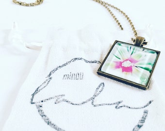 Starburst antique bronze plated pendant necklace