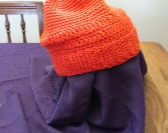 Bright orange crocheted beanie