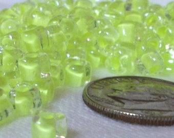 11//0 Round TOHO Japanese Glass Seed Beads #977-Crystal//Neon Purple Lined 10g