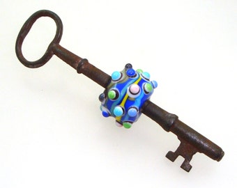 Handmade Lampwork Glass Bead - Beaded skeleton key. Colorful bumpy dots & lines on cobalt blue. Vintage steampunk jewelry compnent pendant.