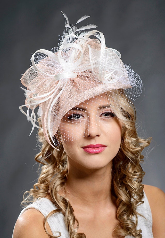 Pink fascinator with spot veiling cocktail hat by MargeIilane