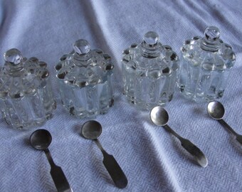 Four covered salt cellars with sterling silver spoons