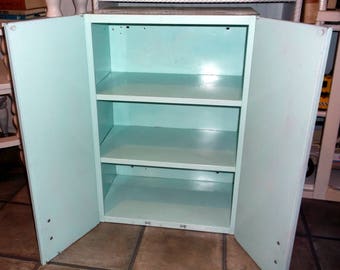 Vintage Hanging Metal Cabinet with 2 doors and 3 shelves painted a light turquoise sea foam green