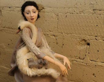 Art doll the ballerina Anna Pavlova and a swan.