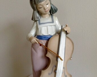 Nao Lladro Figurine. Girl playing a String Instrument. Bargain Price. See details.