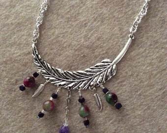Metal pendant with various wire wrapped dangles
