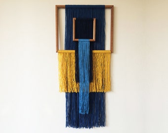 macrame wall hanging with wooden picture frames | geometric tapestry | blue and yellow yarn | colorful interior | textile art | boho home
