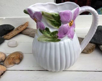 Vintage white pottery vase with pink floral design