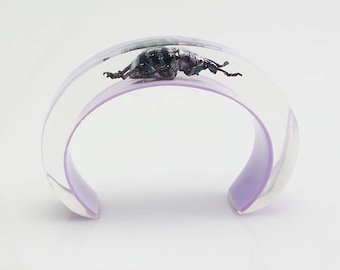 Lilac lucite cuff bracelet with real beetle