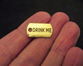Pack 15 Antique Distressed Gold Tone Drink Me Alice in Wonderland Charms 17 x 10mm