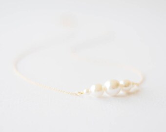 Delicate gold white pearl necklace