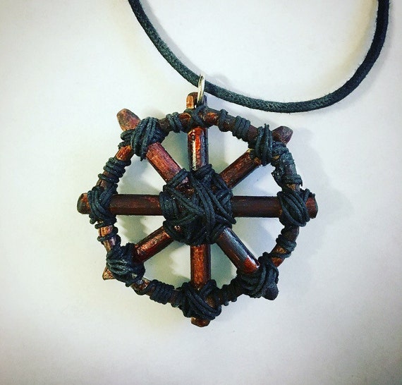 Wheel of pain pendant based on pendant from Conan the