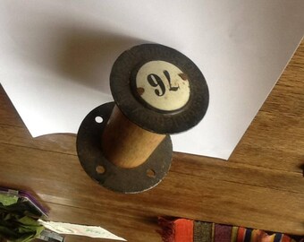 Antique vintage spool number with writing and number 76