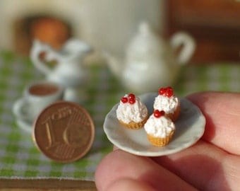 Miniature cake on the plate. Sweets . Miniature food. Miniature in a dollhouse. On the scale of 1/12