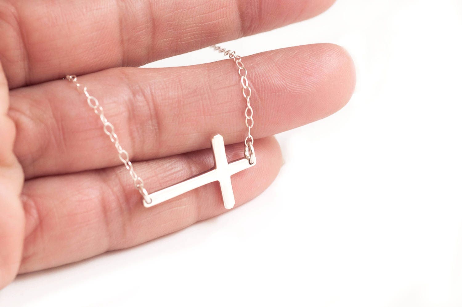 What Is The Significance Of The Sideways Cross Necklace