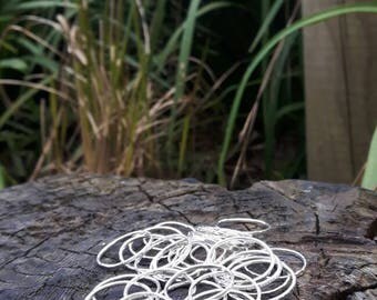 Four sterling silver stacking rings.