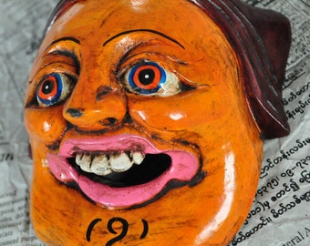 Mask carved wooden - the woman