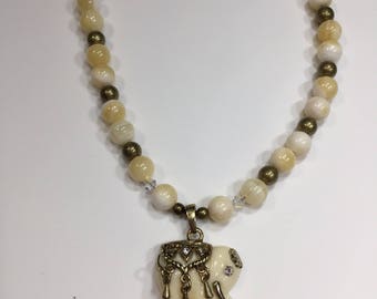 Ivory colored small elephant necklace