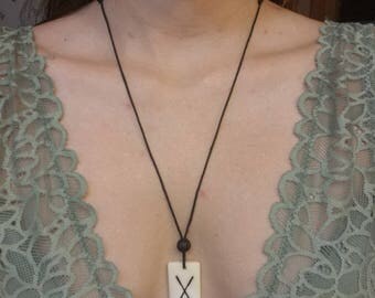Long X charm necklace