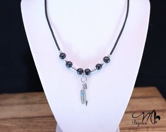 leather necklace with arrow and feather