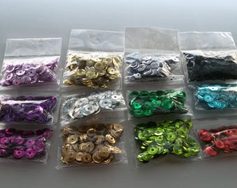 set of 12 packets of sequins