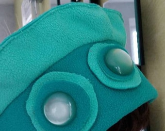 Watery green and blue fleece beret adorned with two buttons Pearlescent light green.