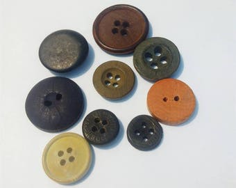 Set of 9 different vintage wooden, round buttons.