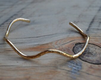 Brass bracelet featuring a hammer textured finish and wave pattern. Gold brass bracelet, brass cuff bracelet