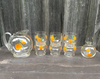 Eight piece breakfast juice set from the 1940s with oranges Pitcher cups vase