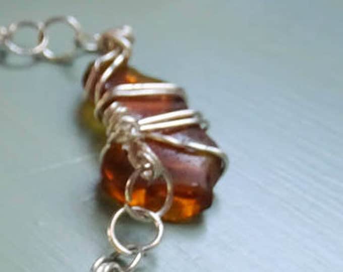 Charm bracelet linked together - two large brown and two white Lake Michigan Beach Glass - toggle clasp