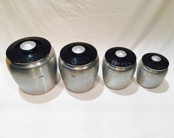 1950s Kitchen canisters, Kromex, Spun aluminum, Canisters, Set of 4, Containers, Aluminum ware, Black plastic lids