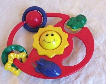 Fall Sale Vintage multi coloured, multi activity rattle. Stroller/crib/car seat toy.