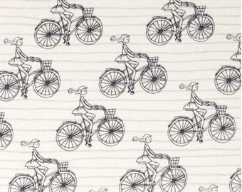 Art Gallery knit fabric by the yard. White with black sketch of girl on bicycle. 95/5 cotton/spandex. Super soft, high quality knit fabric