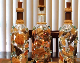 wine bottles, wine bottle lights, glass, led lights, decoration, decor, sea shells, beach, glass beads