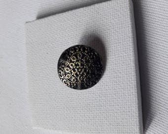 Button sewing antiqued bronze patina.
