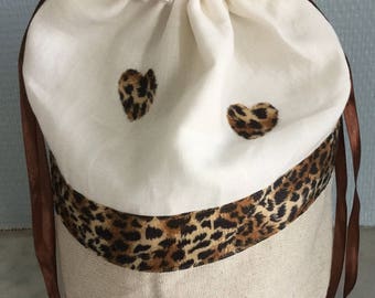 Beige lingerie and leopard leather bag