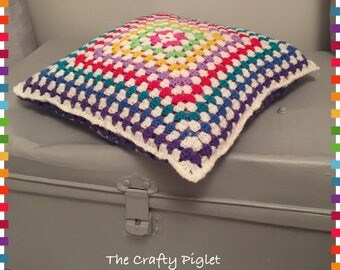 Rainbow granny square cushion
