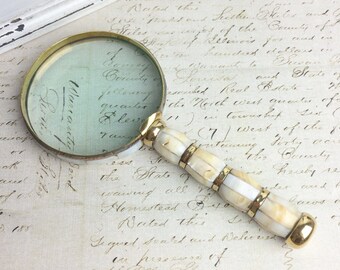 Vintage brass and mother of pearl magnifying glass