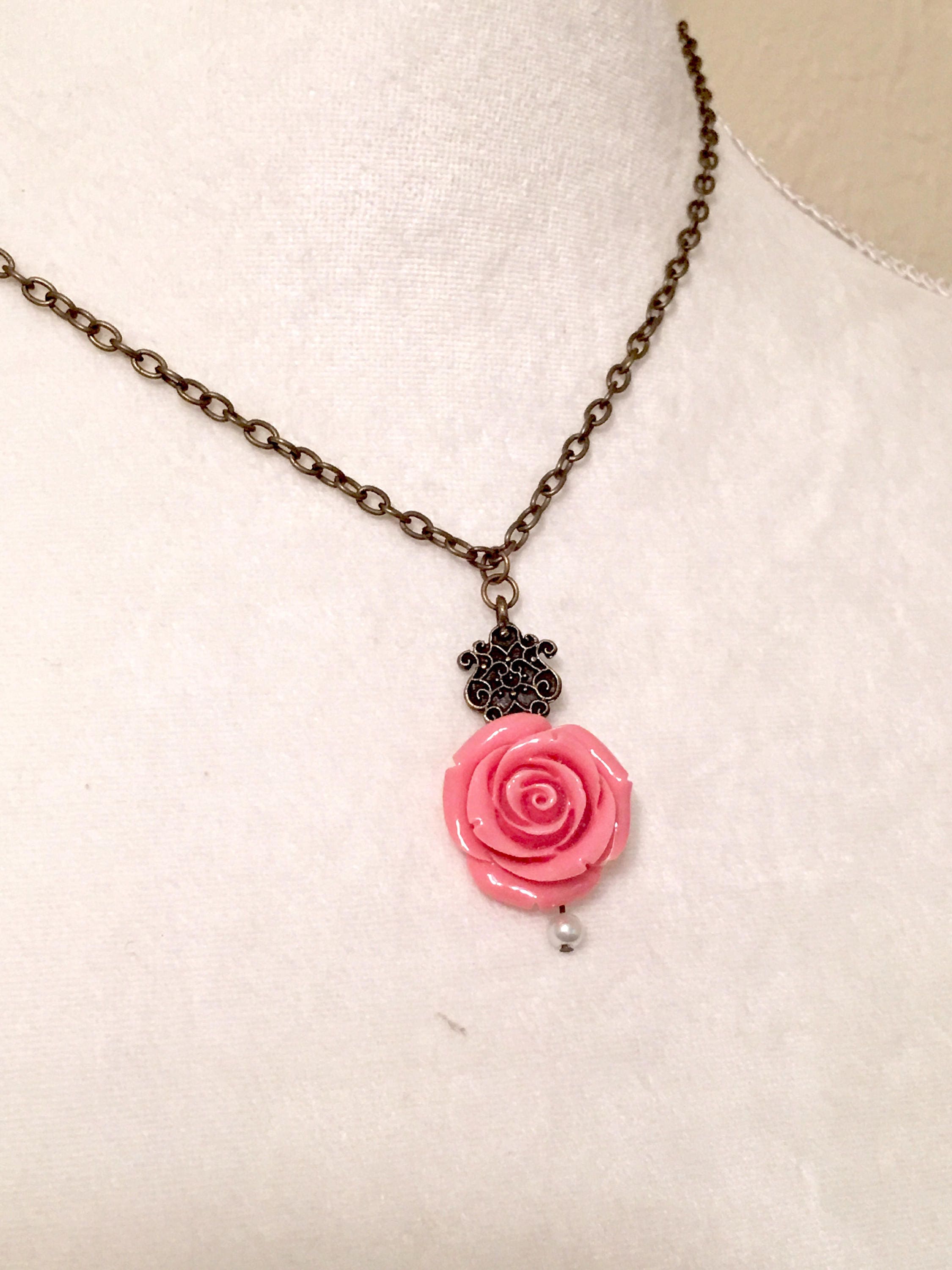 Pink rose necklace Rose necklace with pearl accent on an