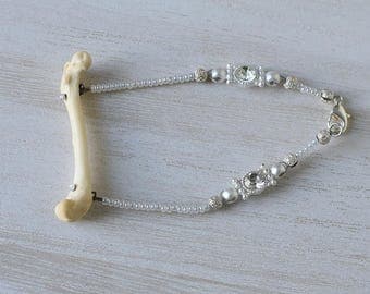 Authentic bone, loose bracelet with white beading and swarovski crystals/rhinestones