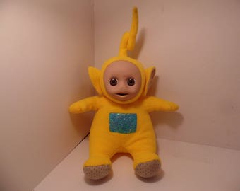 yellow teletubby doll