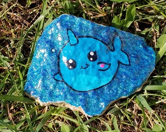 Cute cartooonish narwhal painted rock