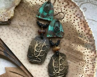 deer earrings with verdigris shields silver charms and amber beads, artisan ceramic deer with antlers, assemblage earrings, Anvil Artifacts