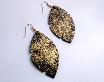 black leather and gold earrings